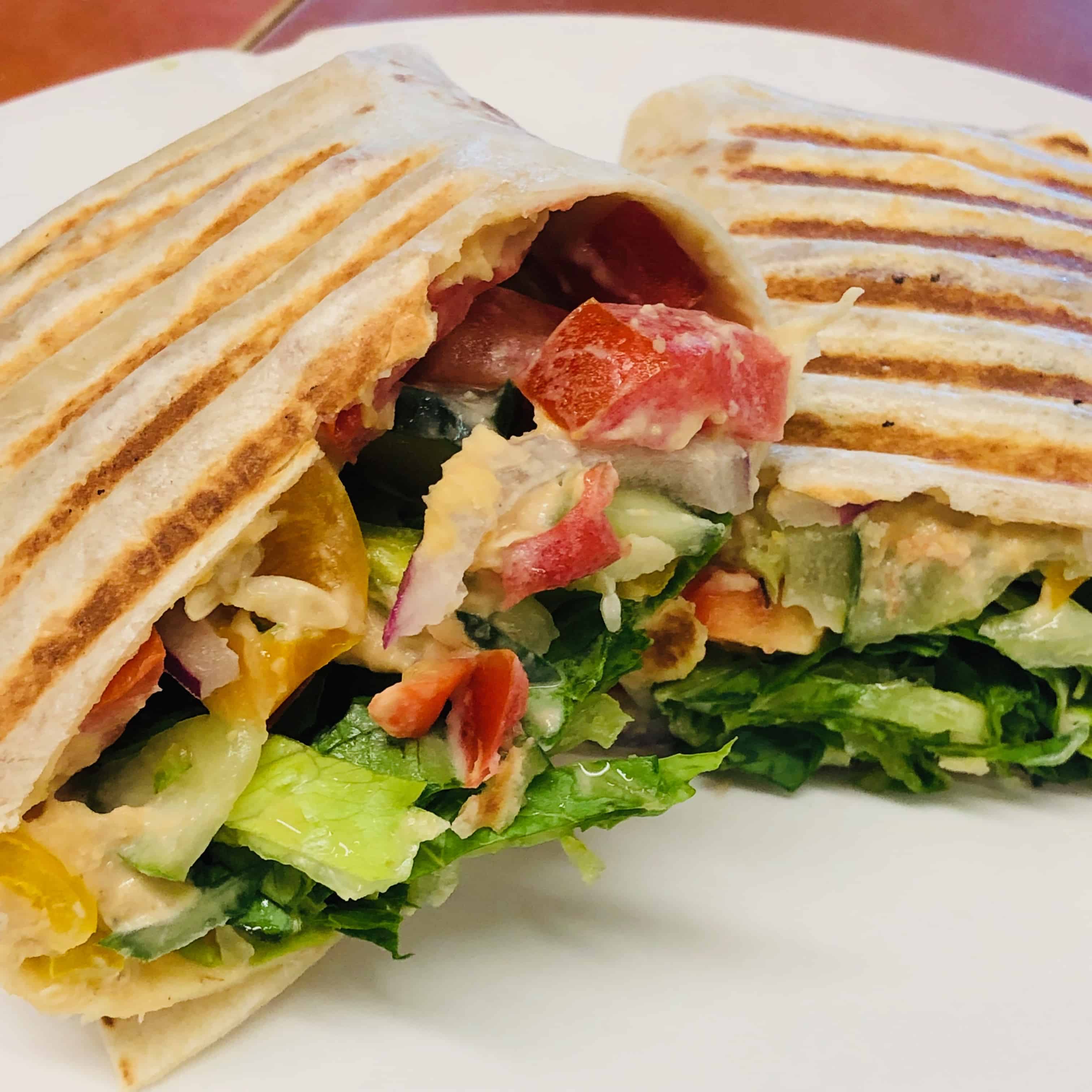 The Hummus Wrap is a very popular out-of-the-gate vegan lunch option, packed with flavor and protein
